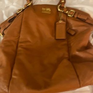 Orange leather Coach bag with gold hardware